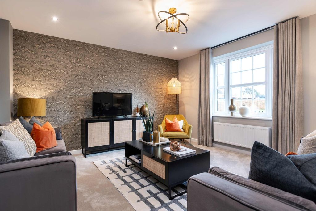 Property photo 3 of 10 A Modern Living Room With Plush Grey Sofas And A Textured Accent Wall In The Foreground