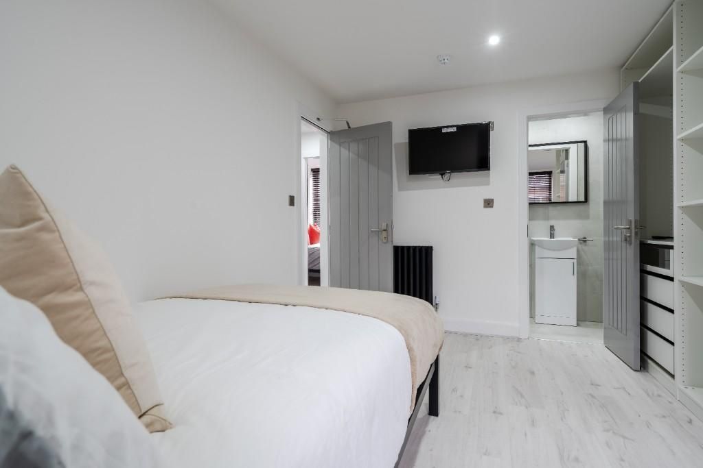 Property photo 2 of 12 A Bright, Clean Bedroom Featuring A Comfortable Be...