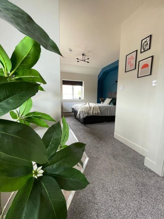 Property photo 3 of 18 A Bright And Inviting Master Bedroom Featuring A c...