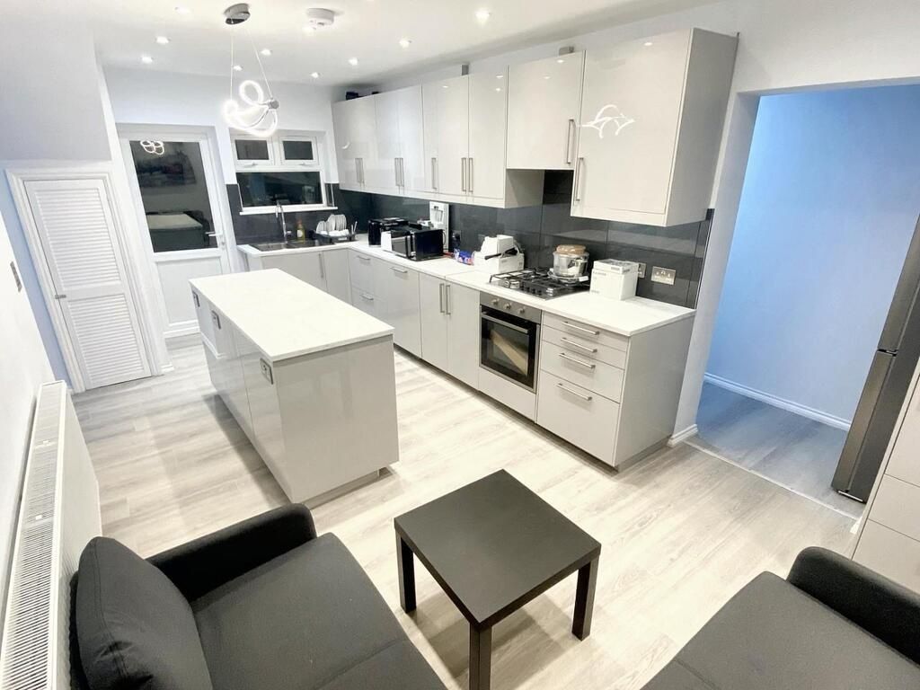 Property photo 1 of 13 Bright Modern Galley Kitchen With A Central Island...