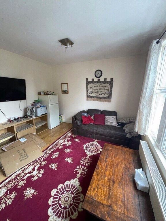 Property photo 3 of 7 Bright Living Room With A Large Patterned Rug, Com...