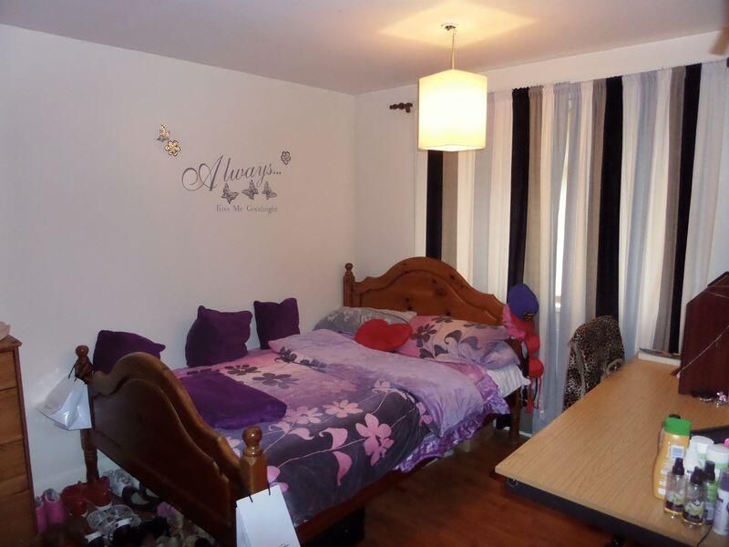 Property photo 2 of 6 A Cozy Bedroom With Twin Beds, Accented With Purpl...