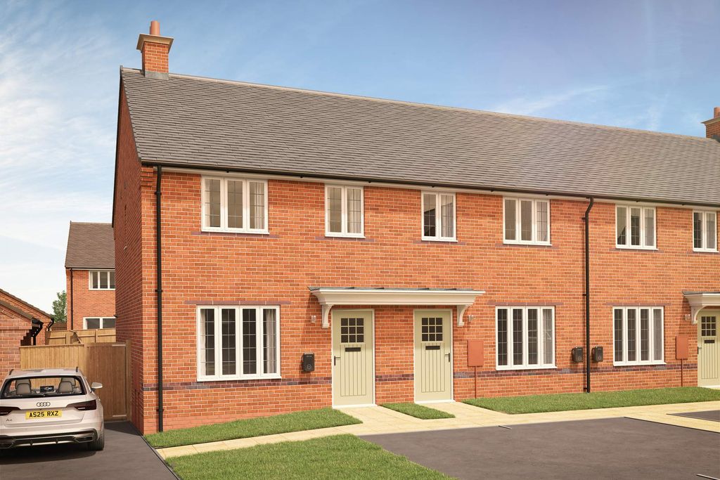 Property photo 2 of 7 A Modern Brick Semi-Detached House With A Car Parked In The Driveway Sits Under A Clear Blue Sky.
