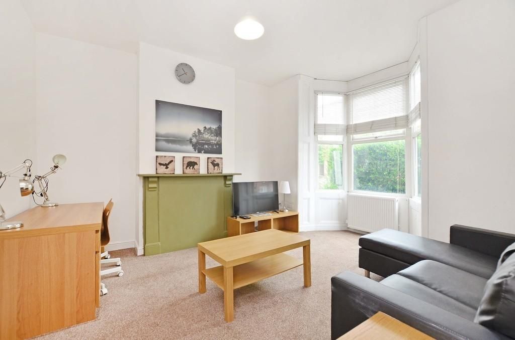 Property photo 1 of 8 Bright And Welcoming Living Room Featuring A Large...