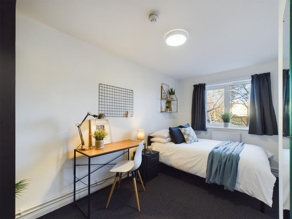 Property photo 1 of 11 A Bright And Cozy Bedroom Featuring A Comfortable ...
