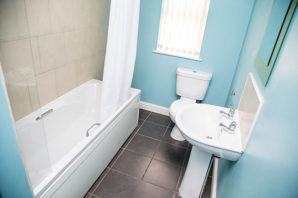 Property photo 3 of 9 Bright And Airy Bathroom Suite Featuring A Comfort...