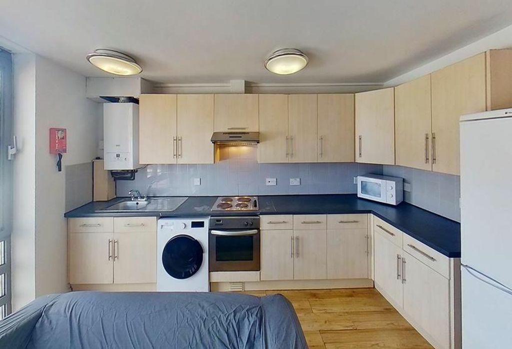Property photo 1 of 4 This Well-Appointed Kitchen Features Modern Applia...