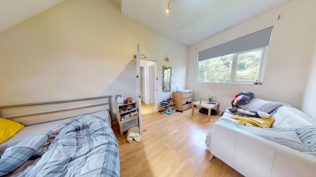 Property photo 1 of 8 Bright And Spacious Master Bedroom Featuring A Lar...
