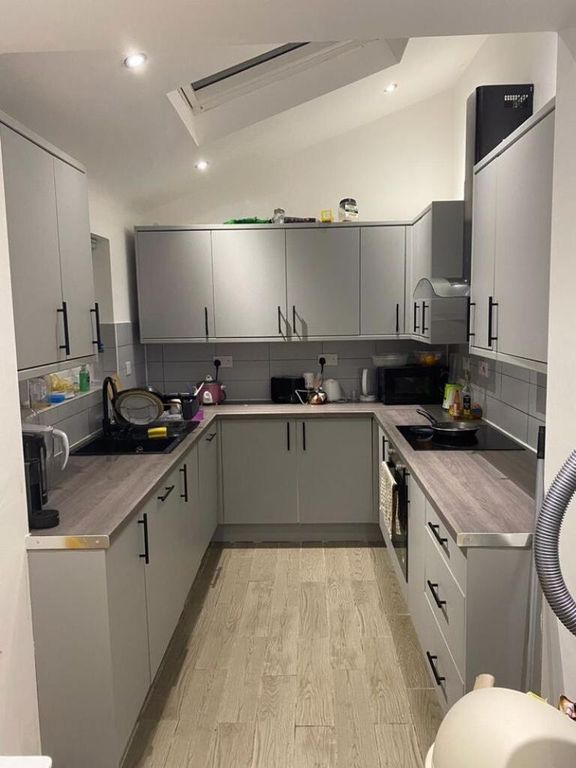 Property photo 3 of 5 Modern U-Shaped Kitchen With Light Grey Cabinetry,...
