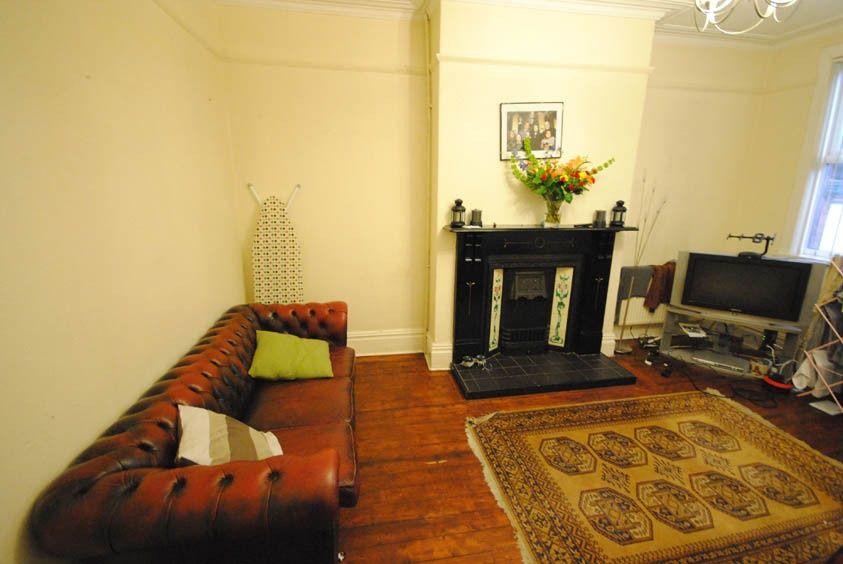 Property photo 3 of 10 Bright And Inviting Living Room Featuring A Comfor...