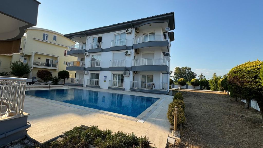 Property photo 2 of 12 Spotless Apartment In Antalya For Sale - Communal Exterior With Well-Maintained Gardens, A Communal Pool And Sun Terraces