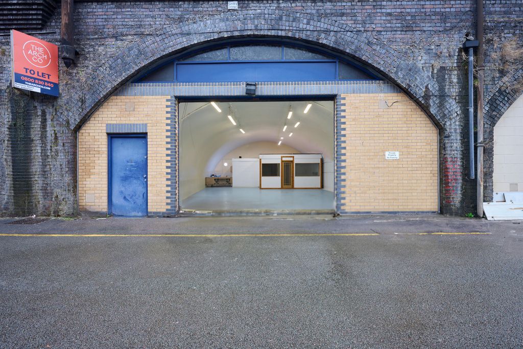 Property photo 1 of 5 The Front Of An Arch With An Open Electric Roller Shutter Entrance Big Enough For Vehicle Access.