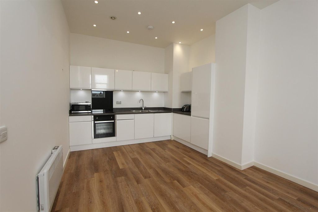 Property photo 3 of 11 Bright Modern Kitchen With Sleek White Cabinets...