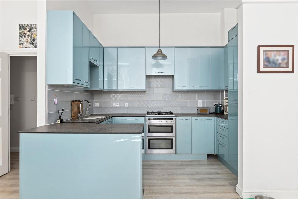 Property photo 3 of 12 Upgraded Kitchen