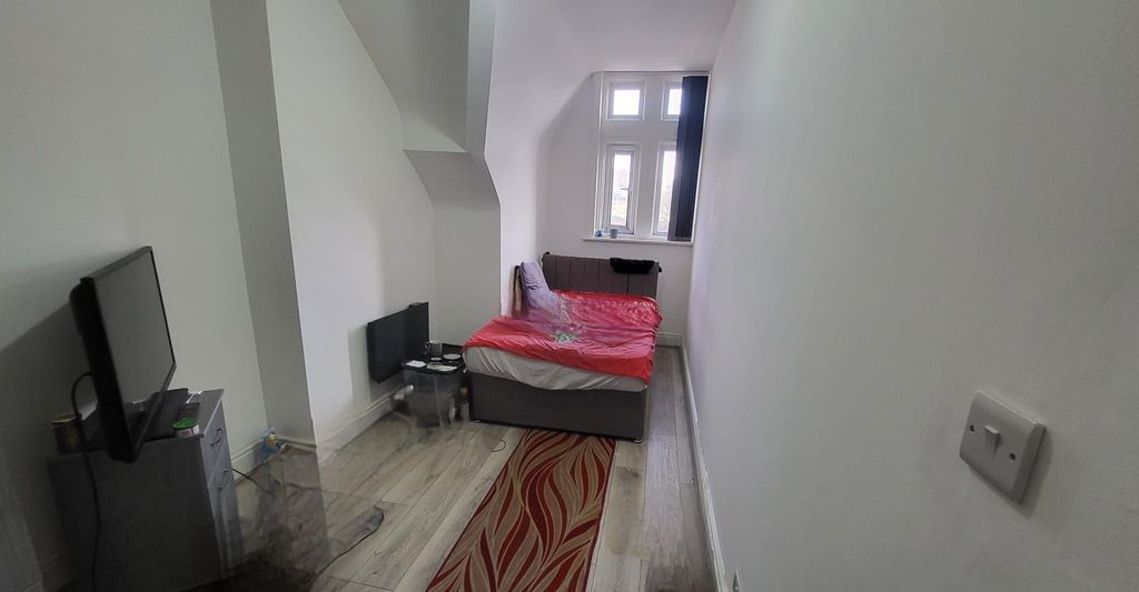 Property photo 3 of 9 Long, Narrow Bedroom With A Single Bed By A Bright...