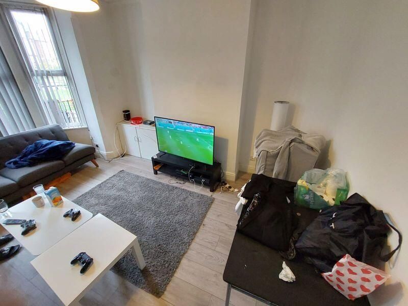 Property photo 3 of 9 A Bright And Inviting Living Room With Ample Natur...