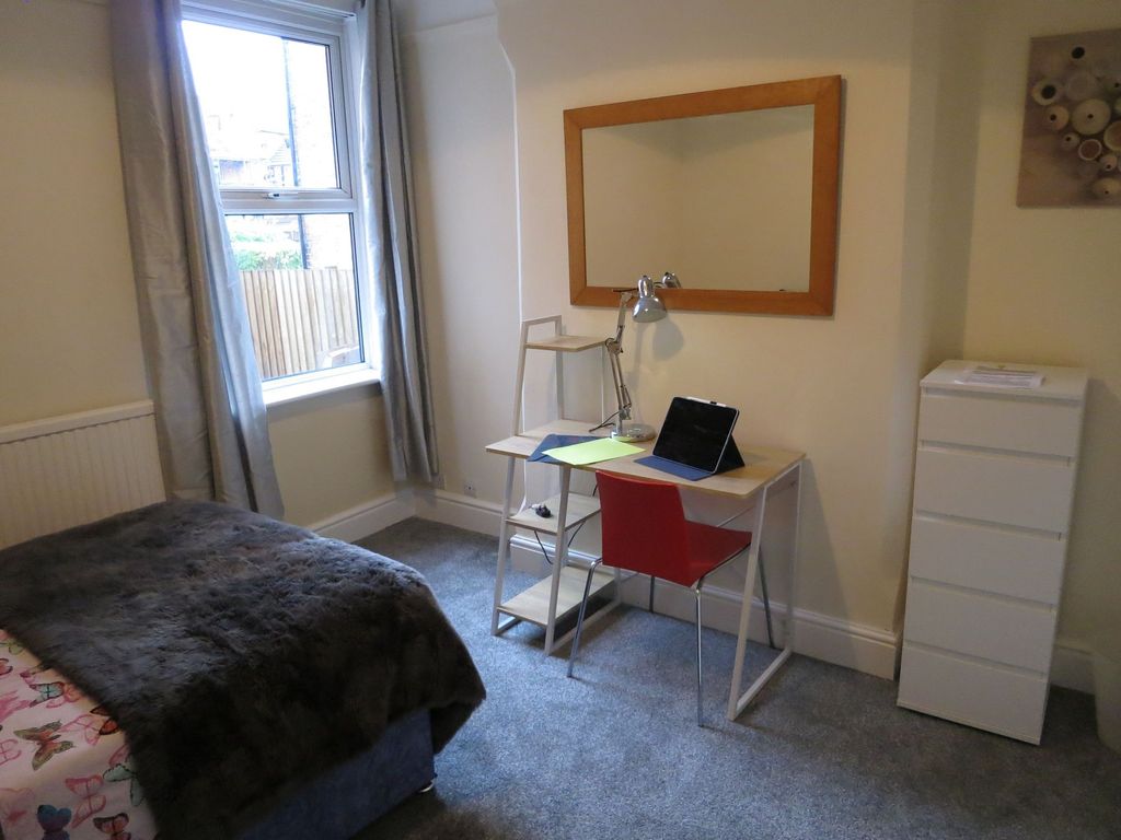 Property photo 3 of 22 A Cozy Bedroom Featuring A Bed With A Furry Throw,...
