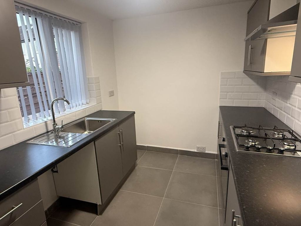 Property photo 3 of 10 A Modern, Well-Lit Kitchen With Sleek Countertops ...