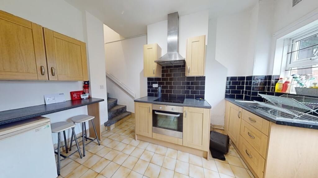 Property photo 3 of 10 Bright And Functional Kitchen Featuring Modern App...