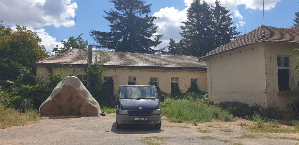 Property photo 3 of 53 Open Courtyard Area Featuring A Blue Van And Stacked Hay Bales Under Plastic Cover