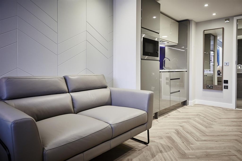 Property photo 2 of 6 Modern Lounge With Grey Sofa And Fitted Kitchen...