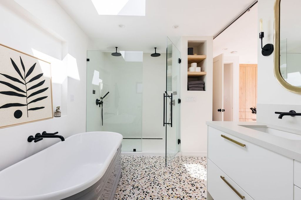 Property photo 3 of 5 A Modern And Clean Bathroom Featuring A Bath And S...