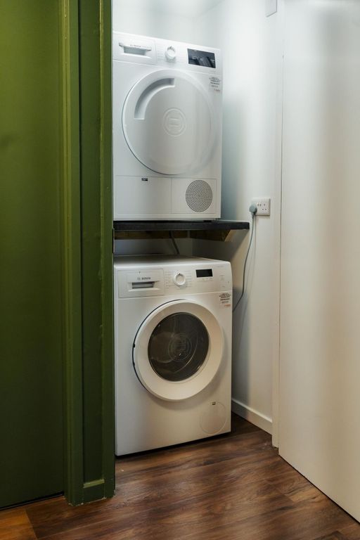 Property photo 2 of 22 A Compact But Well-Maintained Laundry Area With St...