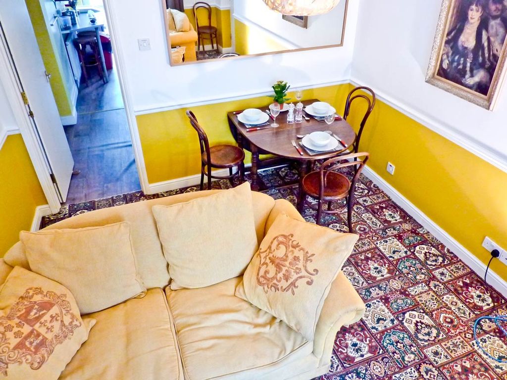 Property photo 3 of 8 A Bright And Inviting Living Room With Comfortable...
