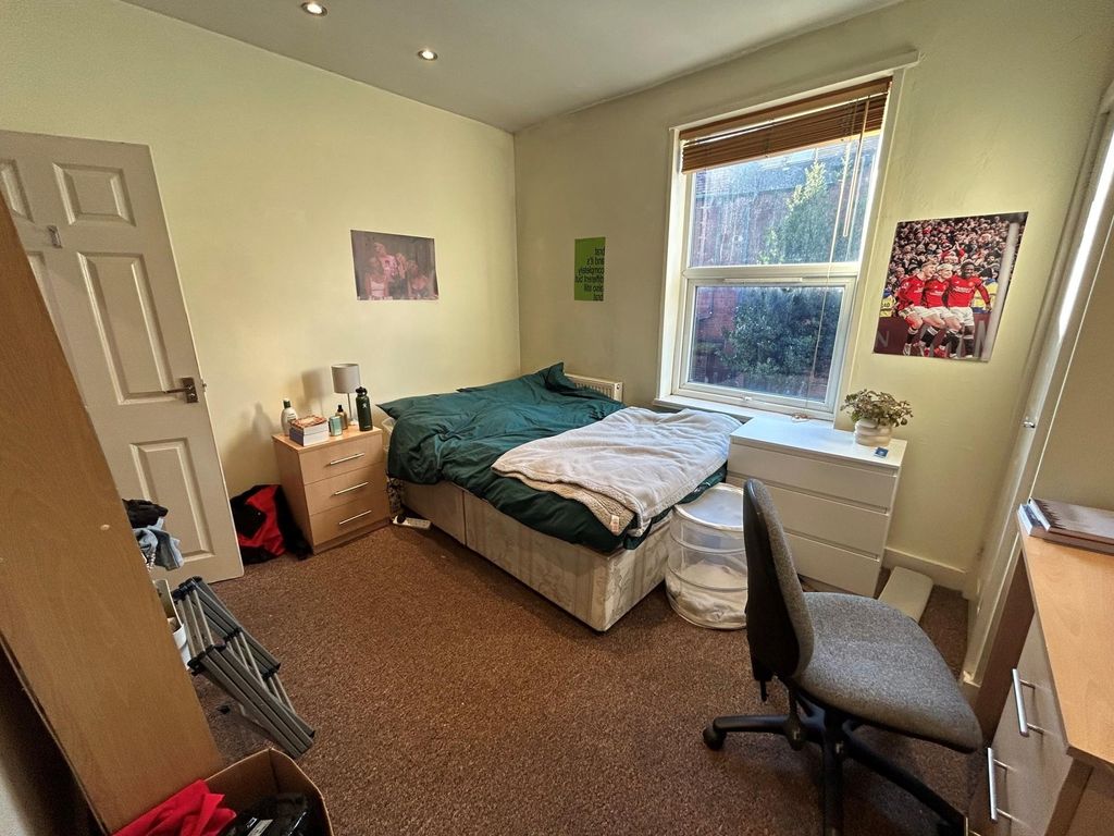 Property photo 3 of 14 A Spacious And Bright Master Bedroom Featuring A l...