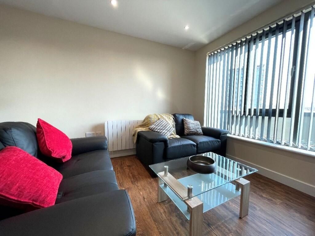 Property photo 2 of 13 A Modern Living Room Featuring Two Black Sofas Acc...