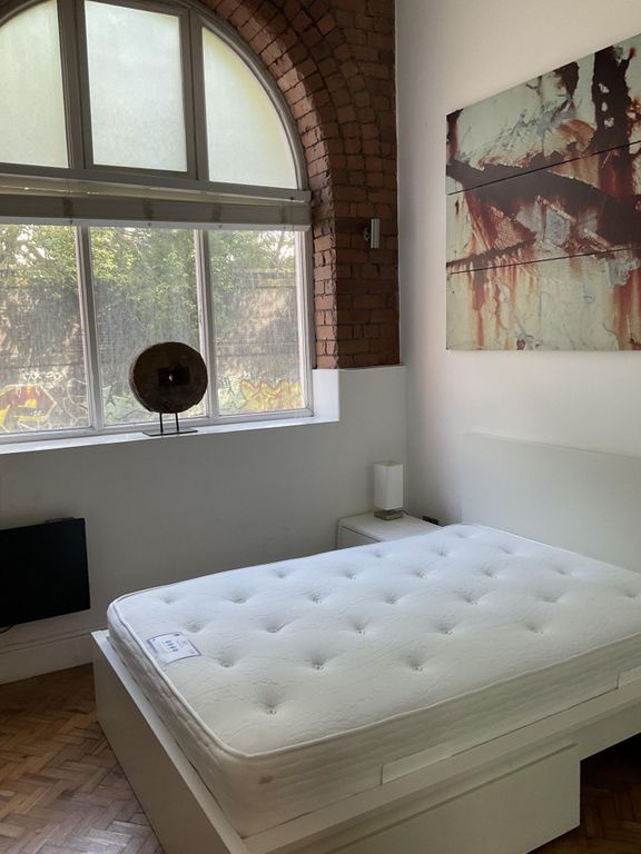 Property photo 2 of 11 Bright And Airy Master Bedroom Featuring A Large W...
