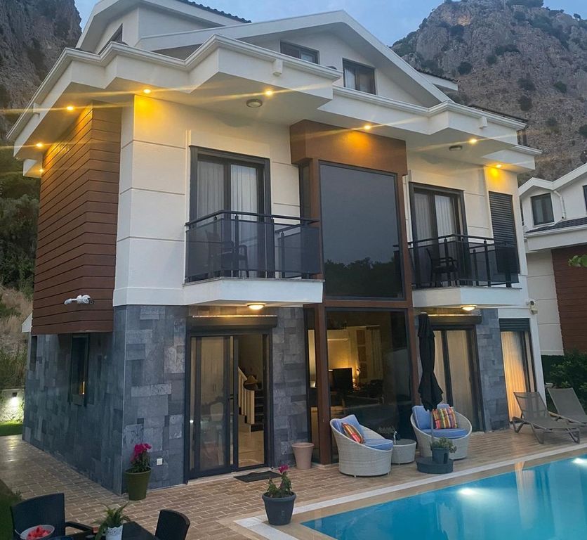Property photo 1 of 19 Detached Luxurious Triplex Fethiye Villa For Sale - Main View Of The Villa With Pool And Sun Terraces