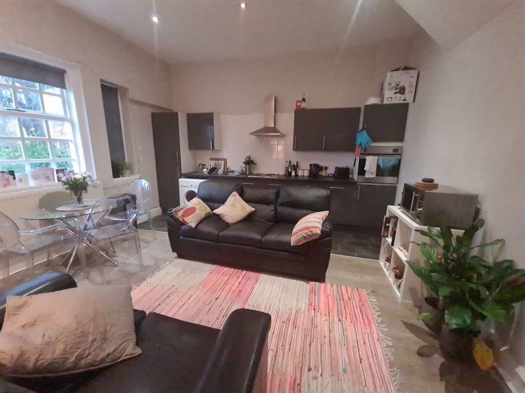 Property photo 2 of 22 Bright And Welcoming Living Room Featuring A Comfo...