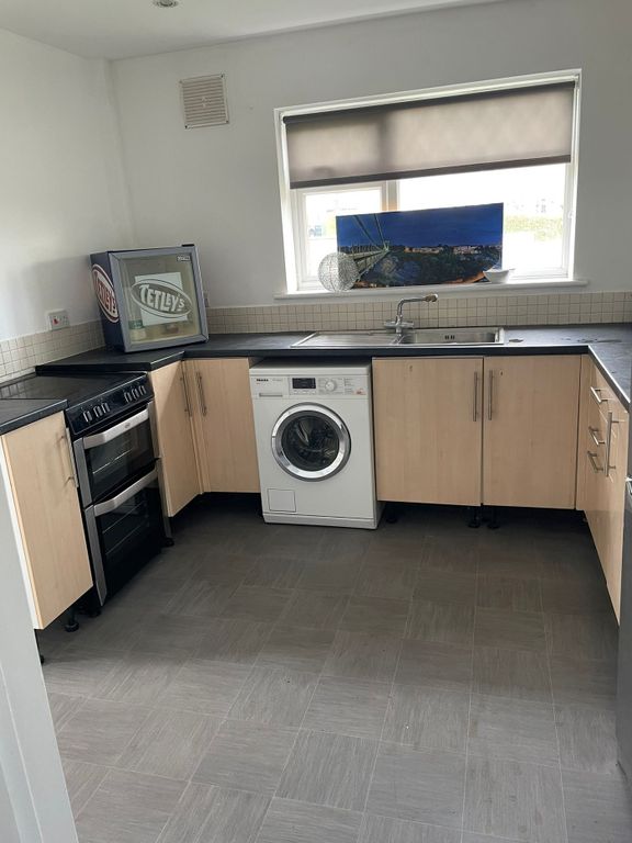 Property photo 1 of 8 A Tidy Kitchen Featuring Essential Appliances, Per...
