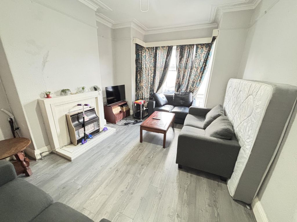 Property photo 2 of 8 A Bright And Spacious Living Room Featuring A Larg...