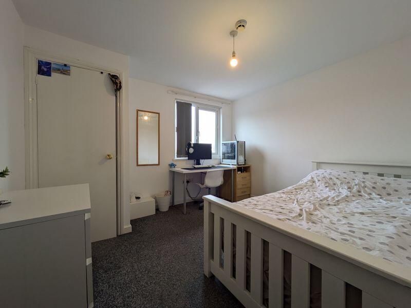 Property photo 2 of 13 Bright And Spacious Master Bedroom Featuring A Com...