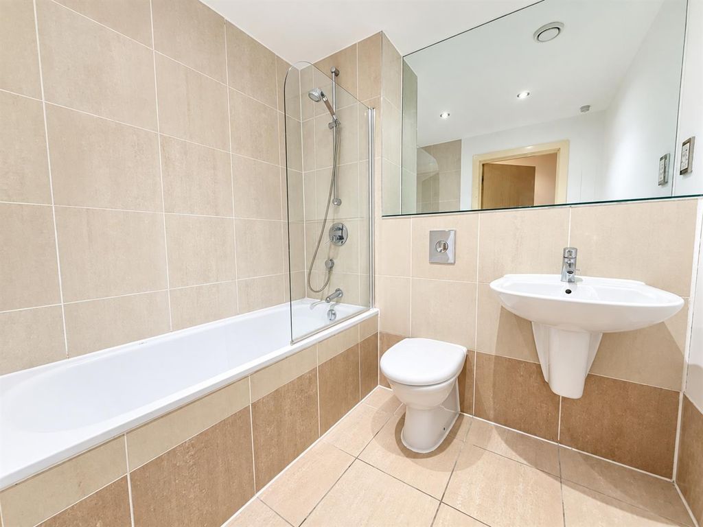 Property photo 3 of 7 Modern Tiled Bathroom With Full-Size Tub & Shower...