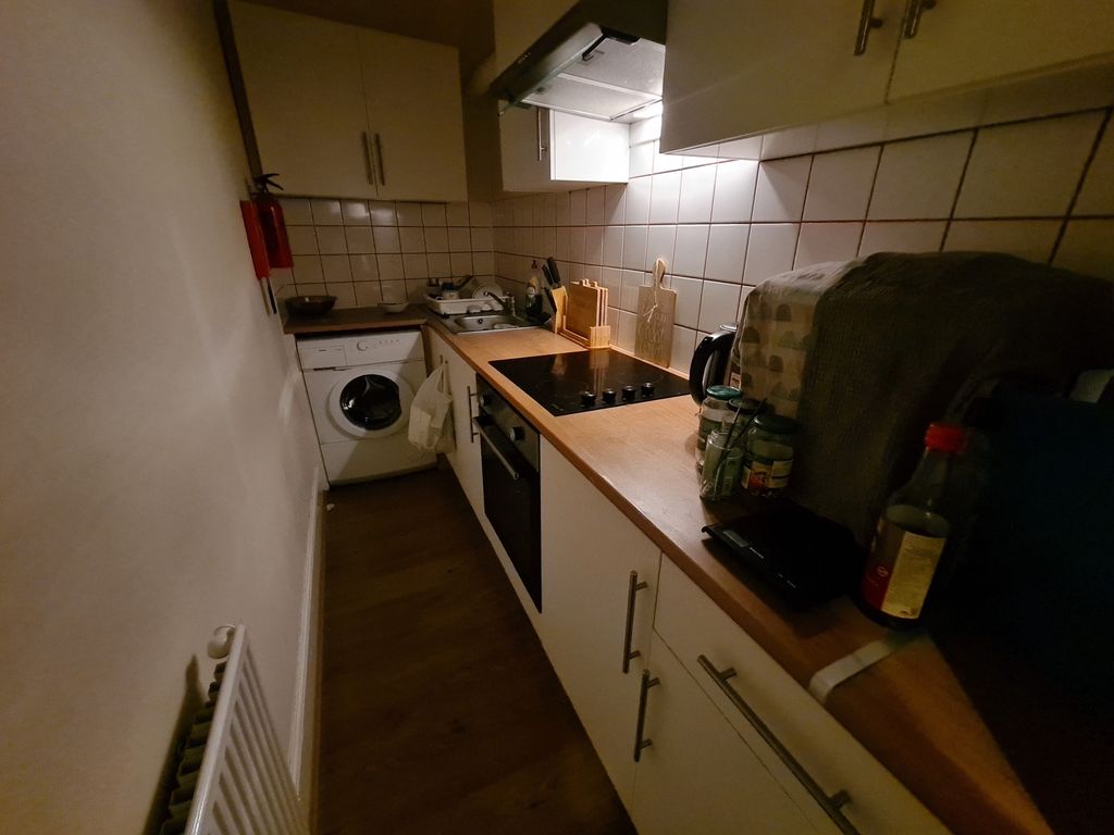 Property photo 3 of 6 A Cozy Kitchen Space Featuring Essential Appliance...