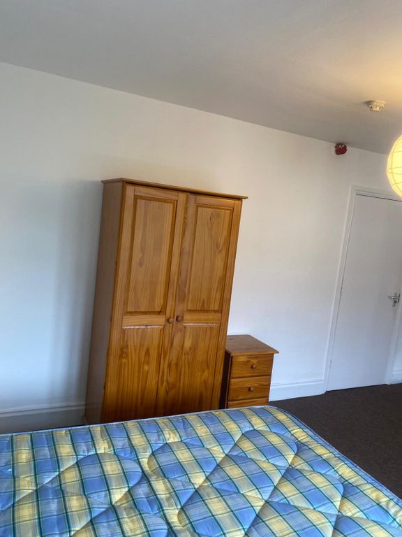 Property photo 3 of 17 A Simple And Tidy Double Bedroom Featuring A Woode...