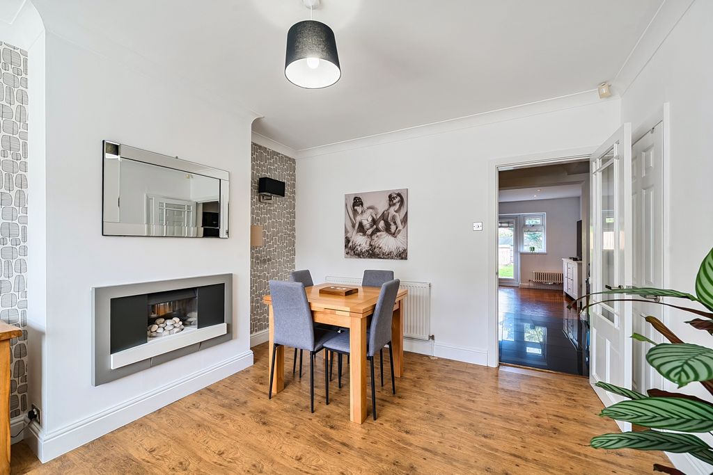 Property photo 3 of 12 Cosy Front Room With Feature Fireplace