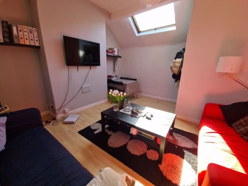 Property photo 2 of 7 A Bright And Inviting Living Room Featuring Modern...