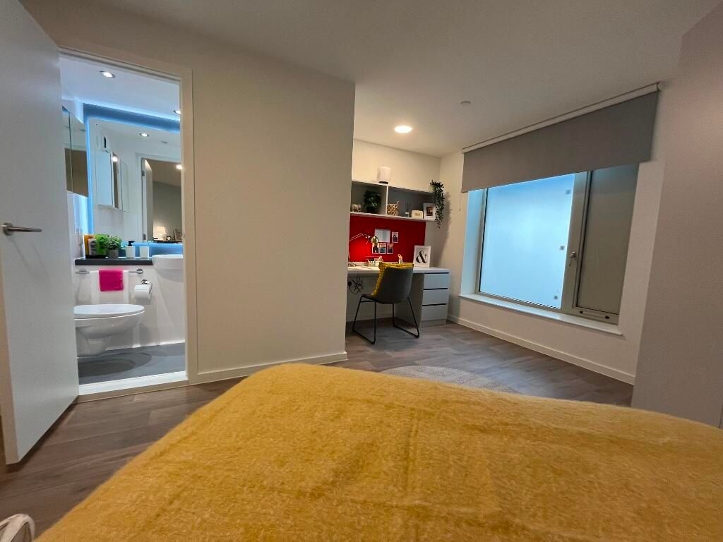 Property photo 3 of 14 A Modern Master Bedroom Featuring A Cozy Double Be...