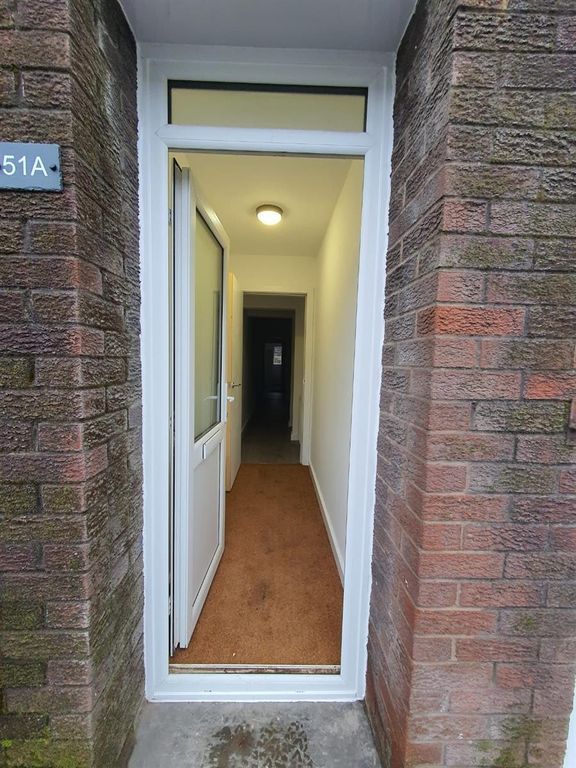 Property photo 1 of 15 Bright Entrance Hallway With Secure White Door....