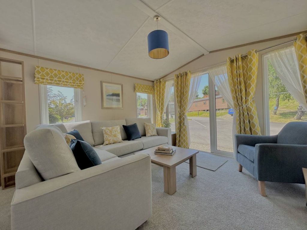 Property photo 3 of 11 Bright Lounge With Patio Doors, Corner Sofa And Armchair