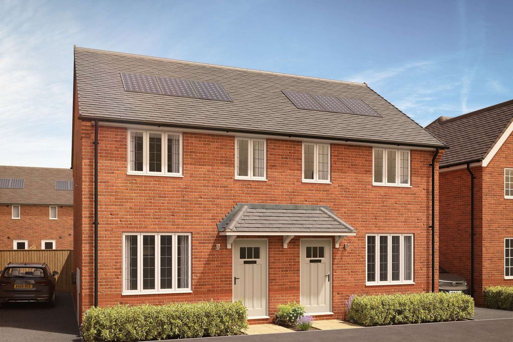 Property photo 1 of 8 A Pair Of Modern Brick Semi-Detached Houses With Manicured Hedges In The Foreground Stand Against A