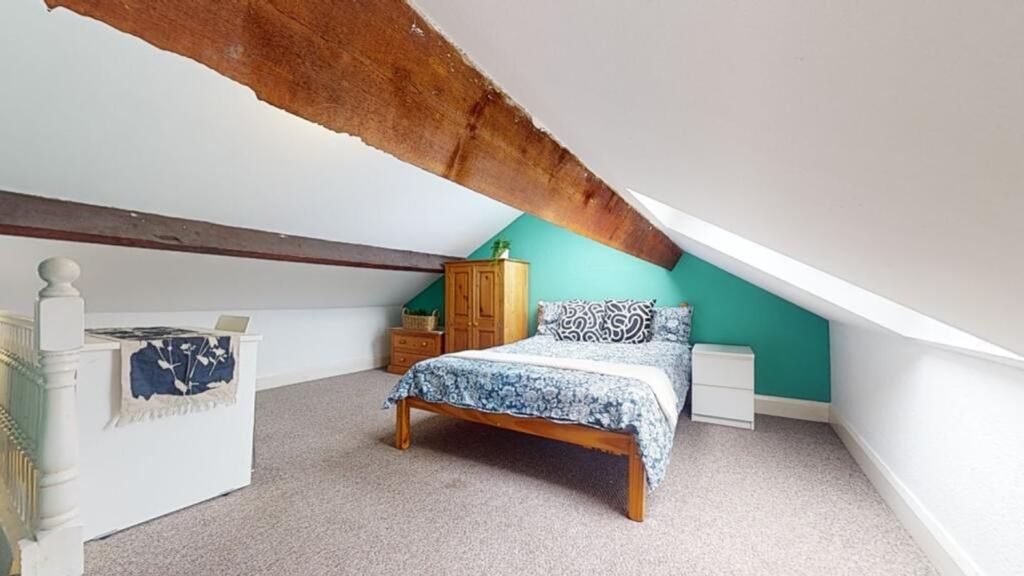 Property photo 3 of 8 Spacious Double Bedroom Featuring A Cozy Bed And A...