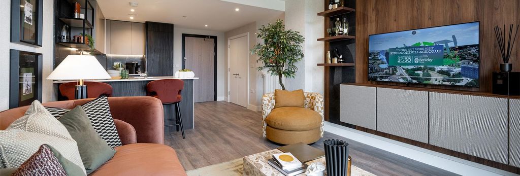 Property photo 3 of 5 Modern Designed Living Space With Sofa Coffee Table, TV Unit, Kitchen Dining Area In Background.