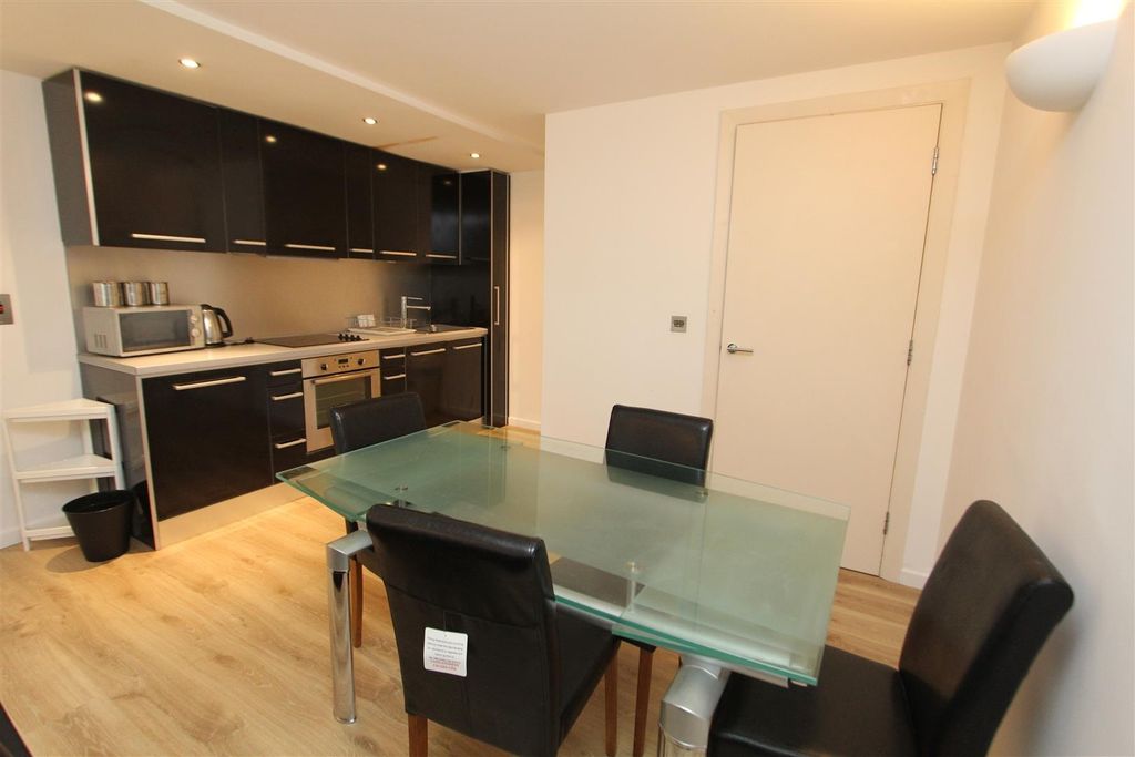 Property photo 3 of 9 Modern Kitchen With Sleek Units And Dining Area...