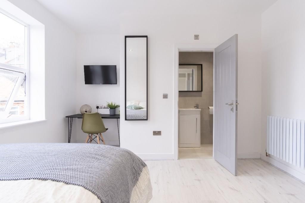 Property photo 1 of 15 A Bright And Airy Master Bedroom Featuring A Comfo...