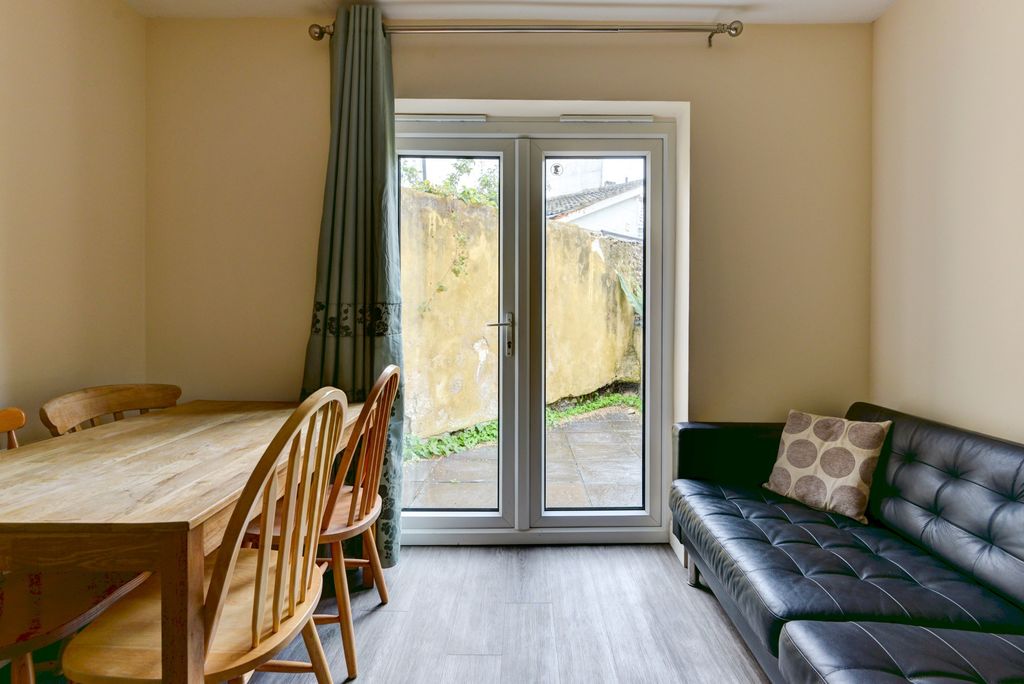 Property photo 3 of 14 A Bright, Inviting Living Room Featuring A Sleek B...
